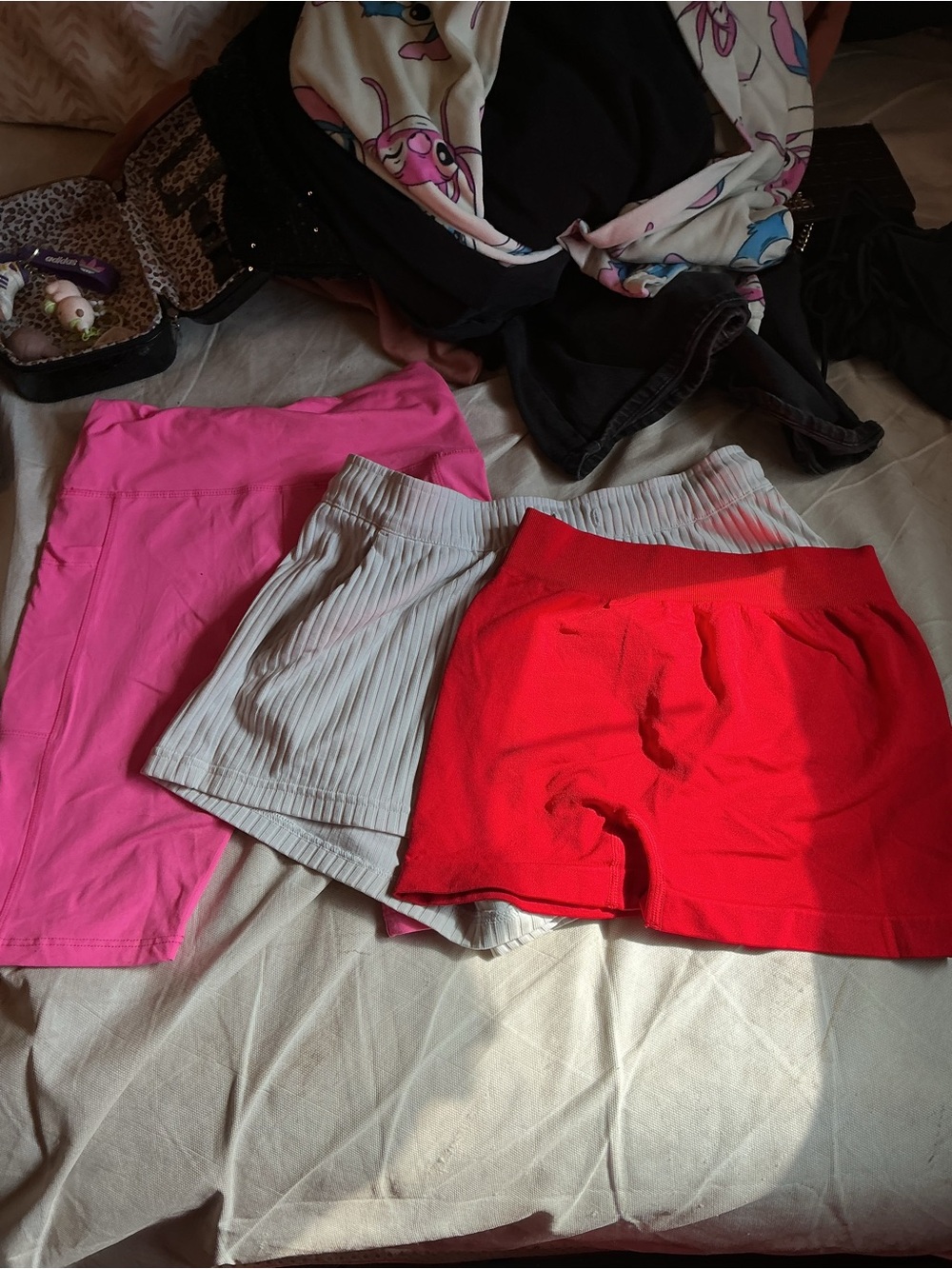 Red and pink biker shorts the white is Nike